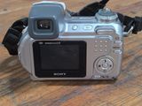 a camera that is sitting on a wooden table