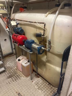 a room with a lot of pipes and a lot of water