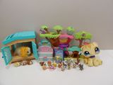 a lot of littlest pet shop toys on the table