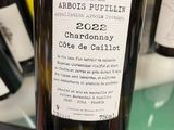 a bottle of wine that is sitting on a table