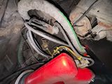 a close up of a red fire hydrant and wires