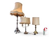 two lamps and a lamp shade on a table
