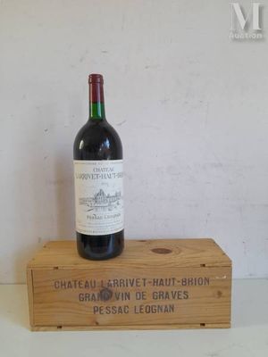 a bottle of wine that is sitting on a wooden box