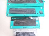 three boxes of computer keyboards sitting on top of a white table