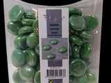 a bag of green glass buttons in it ' s packaging
