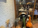 many vases and vases on the floor in this room