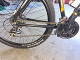 a close up of a bike with a chain attached to it