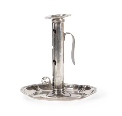 an antique silver plate with a handle and a handle on it