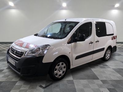 the white van is parked on a checkered floor in a room