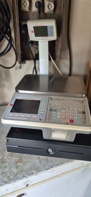 a cash register sitting on top of a counter
