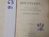 un livre sur lequel est posé un bout de papier