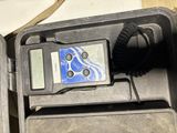 a radio that is sitting in a case on the ground