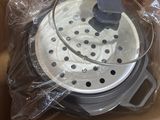an image of a box with a lid that has a pot inside of it