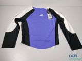 a close up of a purple and black shirt with a tag on it