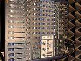 a sound board in the middle of a sound booth