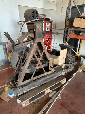 a machine that is sitting on a pallet in a garage
