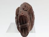 a sculpture of a man holding a fish on a clear base