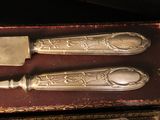 a knife and a fork in a box on a table