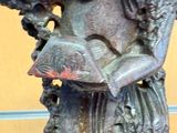 a statue of a woman holding a fish in her hands