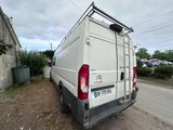 a white van that is parked on the side of the road