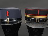 pair of military hats with red and blue stripes on them