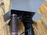 a hair dryer and a blow dryer sitting on a table