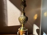 a lamp that is sitting on a table with a green light