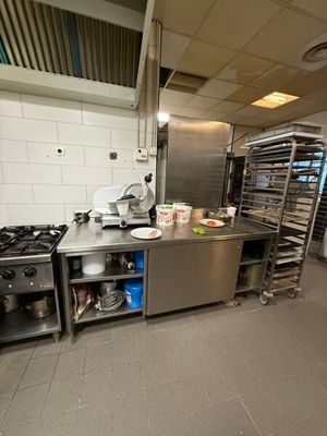a kitchen with a lot of cooking equipment in it