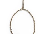 a close up of a necklace on a chain on a white background