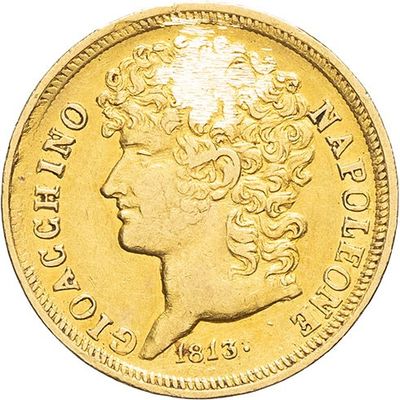 a close up of a gold coin with a woman ' s head on it