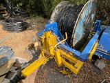 a blue and yellow machine that is sitting on the ground