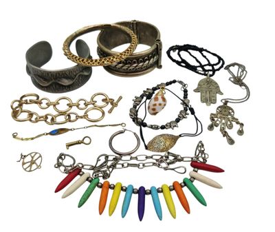 many different bracelets and bracelets on a white background