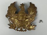 an image of a gold plate with a bird on it