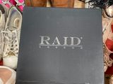 the box is full of pairs of shoes and a pair of shoes