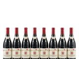 six bottles of red wine lined up in a row