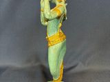 an image of a statue of a woman holding a bird