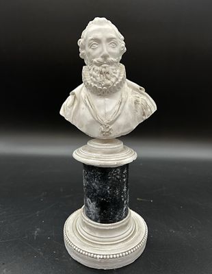 une image représentant le buste d'un homme barbu posé sur un socle