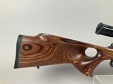 a close up of a rifle on display on a table