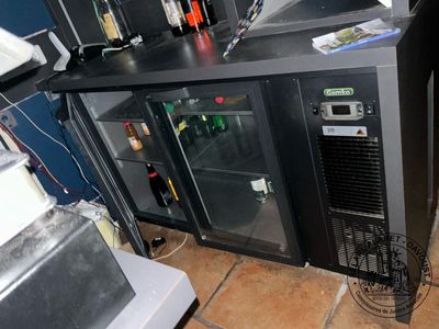 an image of a refrigerator with a lot of bottles on it