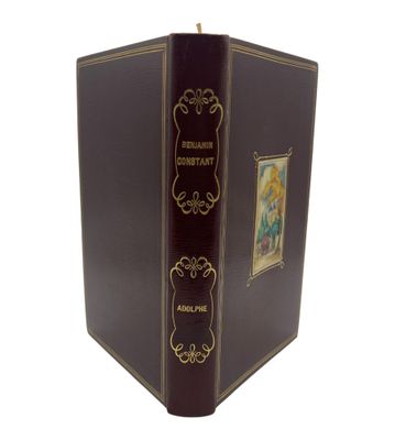 an old book with a picture of a woman on the cover