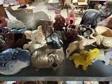 a table with many different types of pottery on it