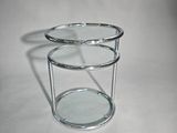 a close up of a table with a glass top on a white surface