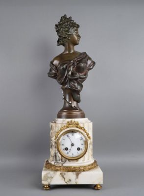 statue of a woman holding a clock on a marble base