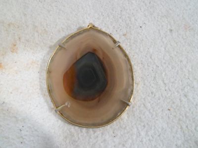 a picture of a piece of glass with a stone inside of it