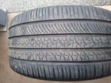 a close up of a tire on the ground next to a wall