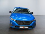 the front view of a blue car parked in a showroom