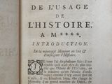 an old book with a black and white image of a man ' s face on it