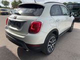 the back end of a white fiat suv parked in a parking lot