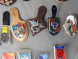 many different types of badges on a table