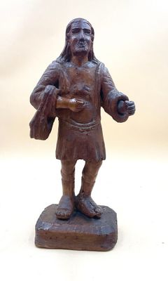 a statue of a man that is holding a bag